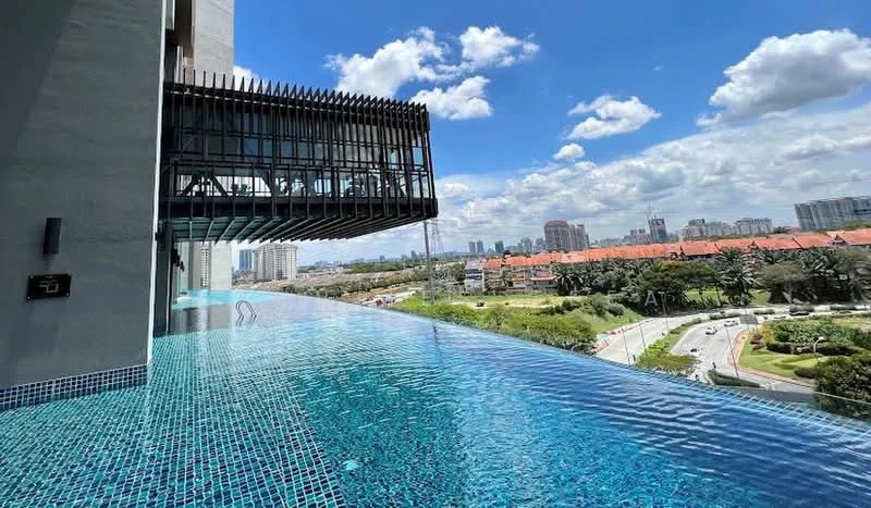 Exterior type: high-rise condominium; features: infinity pool, pool deck with loungers, glass railing, landscaped garden, city skyline view, surrounded by greenery, modern architectural design; style: modern.