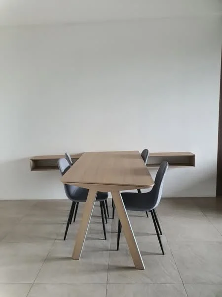 Dining features: rectangular wooden dining table, 4 grey upholstered dining chairs, light-colored wood table legs, wall-mounted shelf, neutral-colored walls, tile flooring, minimalist design; style: modern.