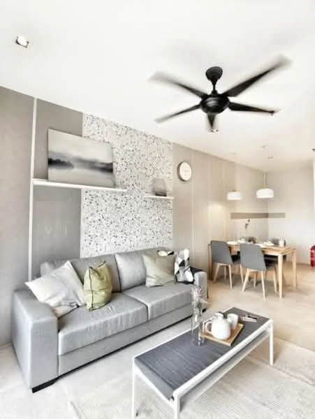 Living features: 3-seater fabric sofa in grey, decorative cushions in green and beige, coffee table with grey top and white legs, pendant lighting above dining area, wall-mounted shelves, textured accent wall with speckled pattern, ceiling fan with 5 blades, wall clock, dining table with wooden finish, 4 dining chairs, neutral-colored area rug, large windows for natural light; style: modern.
