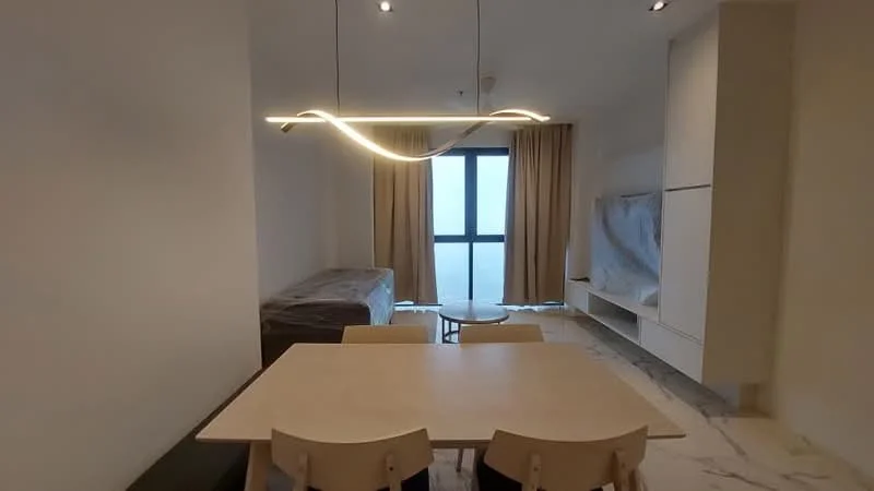 Dining features: light wood dining table, 4 wooden dining chairs, modern pendant light fixture, floor-to-ceiling windows, curtains in beige, light-coloured walls, marble flooring, built-in cabinetry, sofa covered with protective wrap, TV console, decorative wall with minimalistic design; style: modern; view: city.