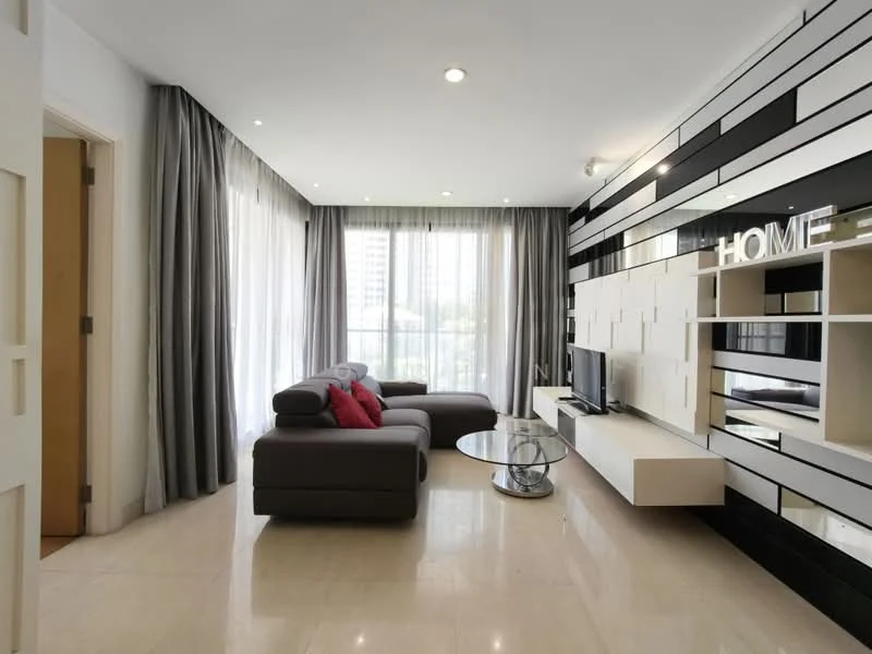 Living features: grey fabric L-shape sectional sofa, red accent cushions, glass coffee table, wall-mounted TV, white entertainment unit, black and white feature wall, floor-to-ceiling windows, sheer curtains, marble tile flooring, recessed downlights; style: modern; view: city.