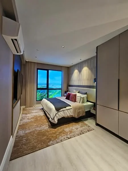 Bedroom features: king-size bed with grey bedding, upholstered headboard, two bedside lamps, built-in wardrobe with sliding doors, wall-mounted TV, area rug with geometric pattern, floor-to-ceiling window, curtains, recessed downlights, wooden flooring, air conditioning unit; style: modern; view: city.