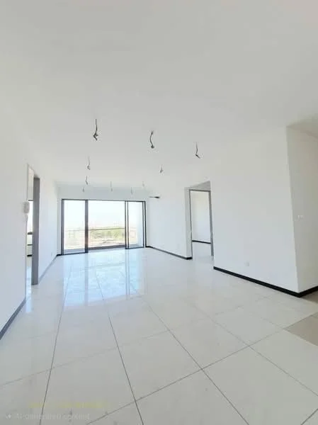 Room features: white painted walls, polished ceramic tile flooring, recessed downlights, floor-to-ceiling windows, sliding glass door, open layout, black trim around windows, view of outdoor space; style: modern; view: garden.