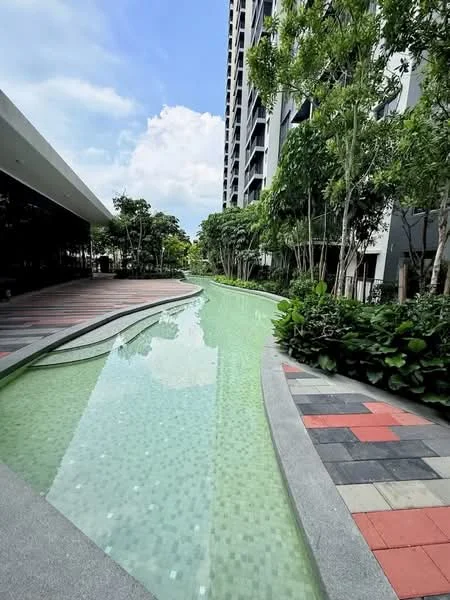 Exterior type: high-rise condominium; features: swimming pool, landscaped garden, manicured pathways, tropical landscaping, paved walkway, surrounding greenery, modern architecture, water feature; style: modern.