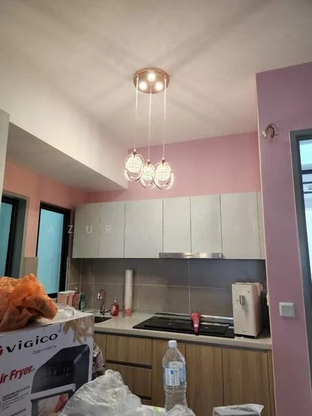 Kitchen features: light pink painted walls, grey cabinetry, wooden base cabinets, stainless-steel sink, chrome pull-down faucet, built-in oven, freestanding refrigerator, pendant lighting with three bulbs, countertop with backsplash, water bottle on countertop, air fryer on countertop; style: modern.