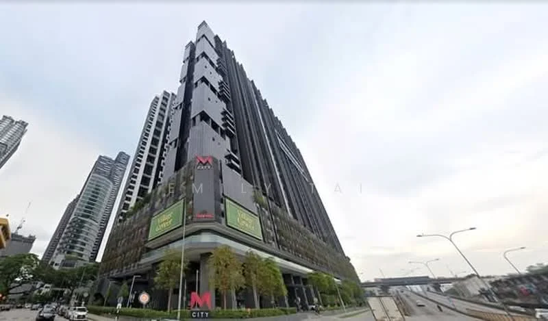 Exterior type: high-rise condominium; features: glass curtain wall, black facade, recessed balconies, vertical fins, landscaped greenery at base, surrounded by urban skyline, multiple storeys, commercial signage at ground level; style: modern.