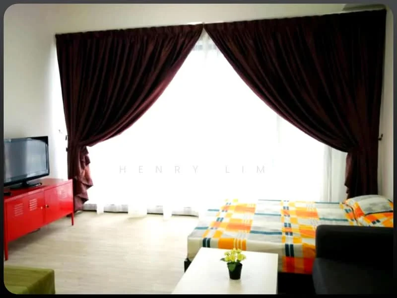 Living features: large window with sheer curtains, brown heavy drapes, queen-size bed with patterned bedding, grey fabric sofa, red TV console, flat-screen TV, wooden flooring, decorative plant on coffee table; style: modern.