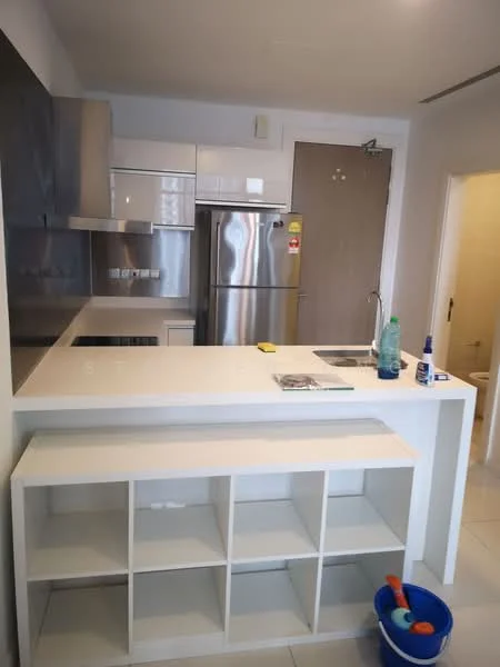 Kitchen features: stainless-steel fridge, stainless-steel range hood, built-in oven, ceramic cooktop, white cabinetry, white countertop, single-bowl stainless-steel sink, chrome pull-down faucet, open shelving, tile flooring, wall-mounted cabinet, kitchen island with storage; style: modern. Room features: door leading to another room, white walls, light-colored flooring.