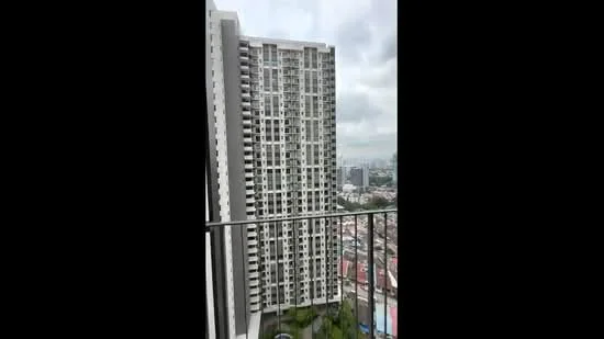 Exterior type: high-rise condominium; features: glass curtain wall, white painted facade, recessed balconies, approximately 20-storey high-rise, surrounded by urban landscape, city skyline view in background; style: modern.