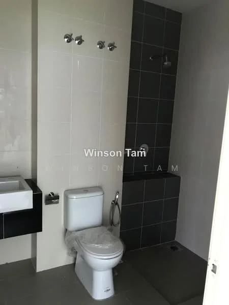 Bathroom features: white toilet, chrome toilet paper holder, single-sink vanity with black cabinet, grey tile flooring, grey accent wall, shower area with wall-mounted shower head, chrome towel rack, mirror above sink; style: modern.