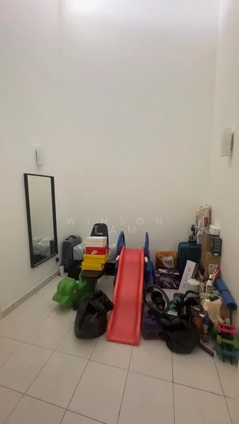 Room features: white painted walls, floor tiles, full-length mirror, various storage boxes, plastic slide, multiple bags, cleaning supplies, exercise mats.