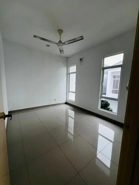 Room features: white painted walls, glossy ceramic tile flooring, 5-blade ceiling fan, floor-to-ceiling windows, sliding window, natural light from windows, neutral color scheme, corner window with view of greenery; style: modern; view: garden.