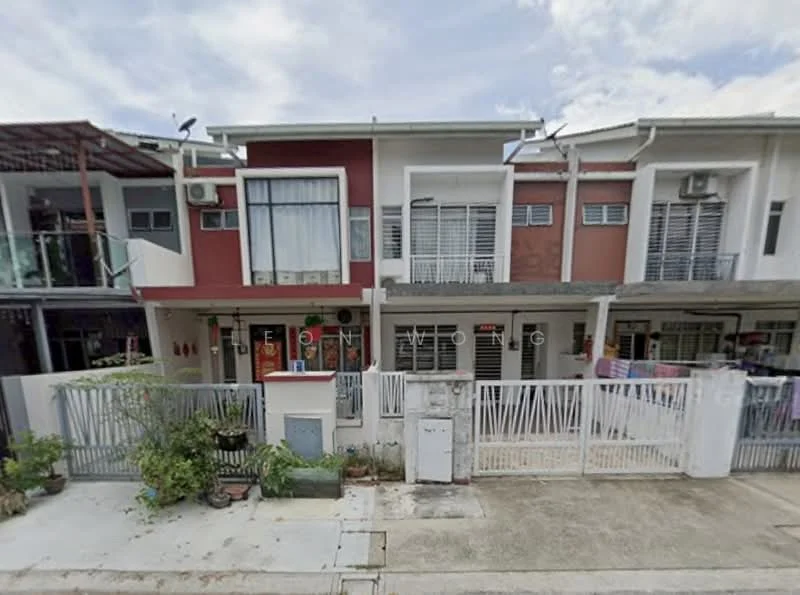 Exterior type: linked terrace house; features: two-storey building, red painted facade, white window frames, balconies on upper floor, manicured front garden, paved walkway, security gate, air conditioning units visible, laundry hanging on balcony, surrounded by residential area; style: modern.
