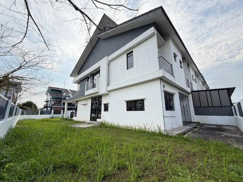 Exterior type: detached bungalow; features: white painted facade, grey accent wall, flat roof, two-storey structure, manicured lawn, paved walkway, surrounded by greenery, multiple windows, balcony on upper floor, driveway, fenced perimeter; style: modern.