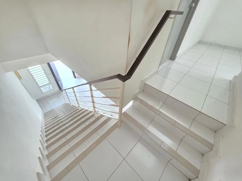 Room features: white painted walls, white tiled flooring, staircase with wooden handrail, metal railing, natural light from window, open space, steps leading down, doorway visible at bottom; style: modern.