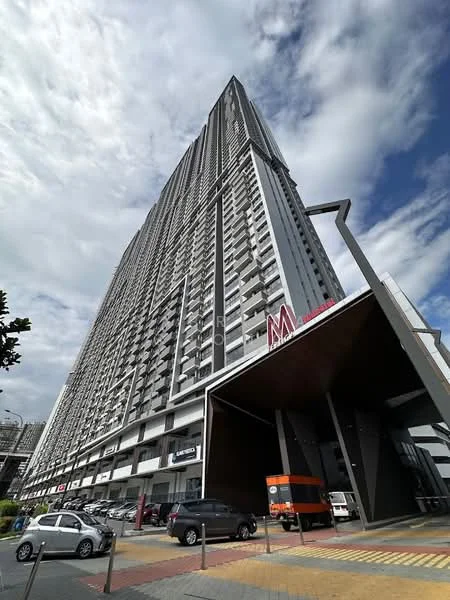 Exterior type: high-rise condominium; features: glass curtain wall, grey painted facade, projecting balconies, double-volume main lobby, covered parking, manicured landscaping, signage visible on facade, multiple storeys, urban context with surrounding buildings; style: modern.
