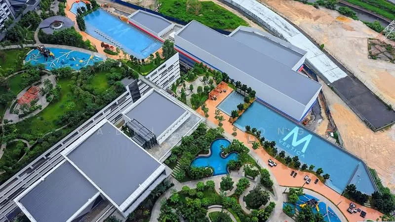 Exterior type: high-rise condominium; features: multiple swimming pools, landscape gardens, manicured lawns, children's playground, outdoor pathways, pool deck with loungers, jacuzzi, tropical landscaping, parking spaces, modern architectural design; style: modern.