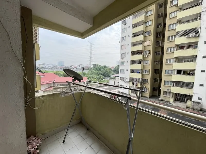 Room features: balcony, concrete walls, grey tiled flooring, metal drying rack, satellite dish, view of surrounding buildings, city skyline in distance; view: city.