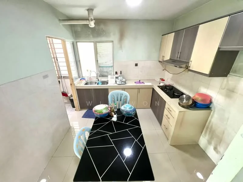 Kitchen features: white painted walls, light grey cabinetry, black granite countertop, stainless-steel sink, chrome pull-down faucet, built-in gas stove, exhaust hood, ceramic tile flooring, dining table with black surface, blue plastic dining chairs, window with sheer curtains, refrigerator, kitchen utensils on countertop; style: modern.