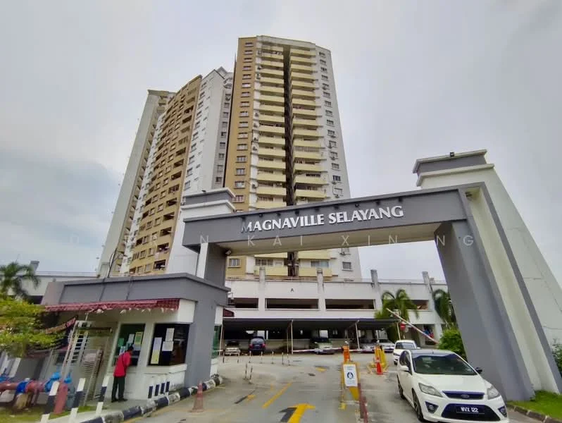 Exterior type: high-rise condominium; features: glass curtain wall, cream painted facade, double-volume main lobby, covered parking, guard house at entrance, perimeter fence, landscaped entrance with palm trees, signage with building name, multiple storeys, driveway with interlocking pavers; style: modern.