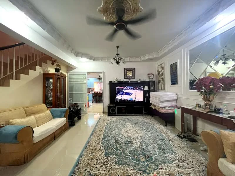 Living features: 3-seater fabric sofa in beige, 2-seater fabric sofa in light brown, large area rug with intricate pattern, wall-mounted TV, TV console, ceiling fan with light, decorative ceiling rose, wall-mounted mirror, crown moulding, tiled flooring, decorative plants in ceramic pots, staircase in background; style: traditional.