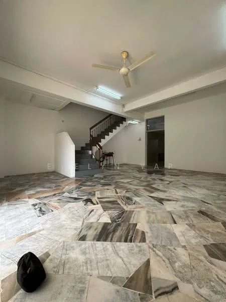 Room features: marble flooring with mixed patterns, white painted walls, exposed ceiling, 5-blade ceiling fan, staircase with wooden railing, natural light from windows, open layout, no visible furniture; style: modern.