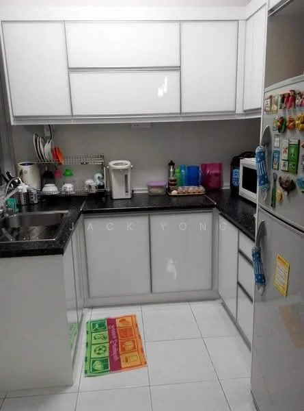 Kitchen features: white shaker cabinets, black granite countertop, stainless-steel single-bowl sink, chrome pull-down faucet, built-in electric kettle, microwave, refrigerator, dishwasher, ceramic tile flooring, wall-mounted shelving, colorful plastic containers, kitchen mat with geometric pattern; style: modern.