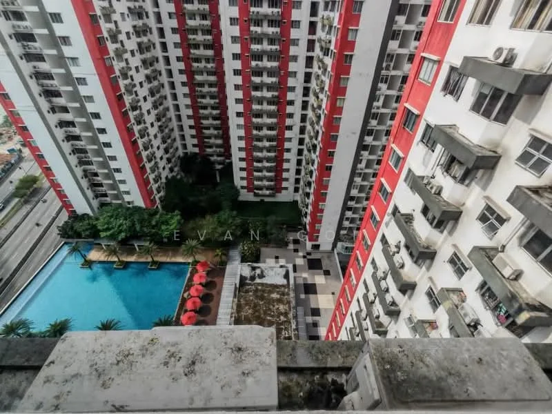 Exterior type: high-rise condominium; features: swimming pool, pool deck with loungers, landscaped garden, red and white facade, balconies with railings, multiple storeys, surrounding greenery, view of nearby road; style: modern.