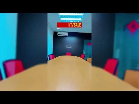 Room features: large wooden conference table, red upholstered chairs, dark blue accent wall, white ceiling, wall-mounted air conditioning unit, glass partition, LED ceiling lights; style: modern.