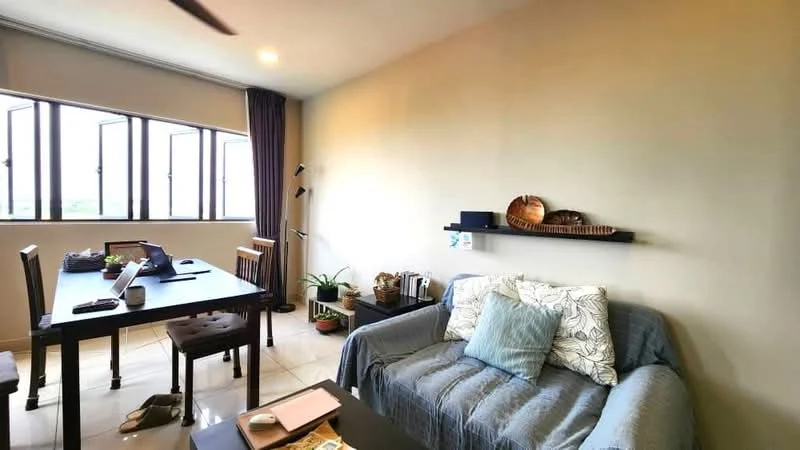 Living features: grey fabric sofa, decorative cushions, wooden dining table, 4 wooden dining chairs, wall-mounted shelf, houseplants in ceramic pots, large windows with multiple panes, light-colored walls, tile flooring, ceiling fan, natural light from windows; style: modern; view: garden.