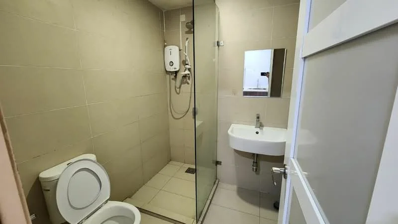 Bathroom features: white tiled walls, light grey tiled flooring, walk-in shower with glass enclosure, rain shower head, handheld shower, single-sink vanity with wall-mounted faucet, mirror above sink, one-piece toilet, water heater, shower drainage, chrome towel rail; style: modern.