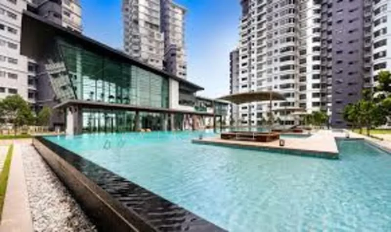 Exterior type: high-rise condominium; features: infinity pool, pool deck with loungers, landscaped garden, glass facade, surrounded by high-rise buildings, outdoor seating area, manicured lawn; style: modern.