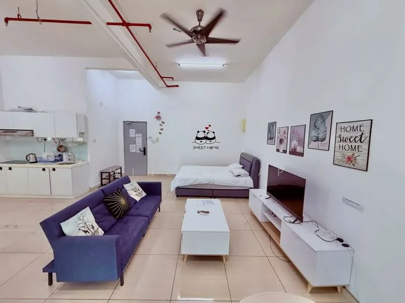 Living features: 3-seater fabric sofa in purple, coffee table, wall-mounted TV, TV console in white, ceiling fan with light, decorative wall art, cream tiled flooring, open layout, decorative pillows on sofa, wall with 'Home Sweet Home' decor; style: modern. Bedroom features: queen-size bed with white bedding, bedside table, wall-mounted light fixture, white painted walls; style: modern.