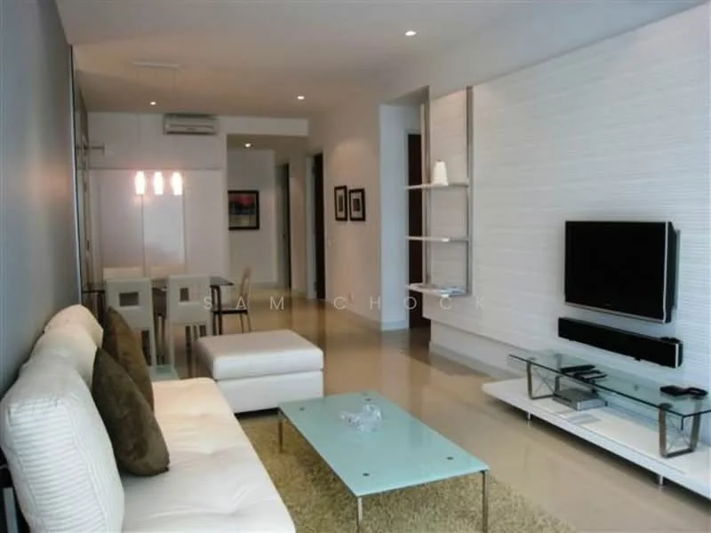Living features: white fabric 3-seater sofa, 2 beige throw pillows, glass coffee table, wall-mounted flat-screen TV, black TV console, light grey accent wall, recessed downlights, open shelving unit, dining area with white table and chairs, air conditioning unit, light-colored tiled flooring; style: modern.