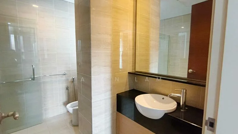 Bathroom features: single-sink vanity with black countertop, round white vessel sink, chrome basin mixer faucet, wall-mounted mirror, glass shower enclosure, toilet, tile flooring, light beige wall tiles, dark wood cabinetry, recessed lighting; style: modern.