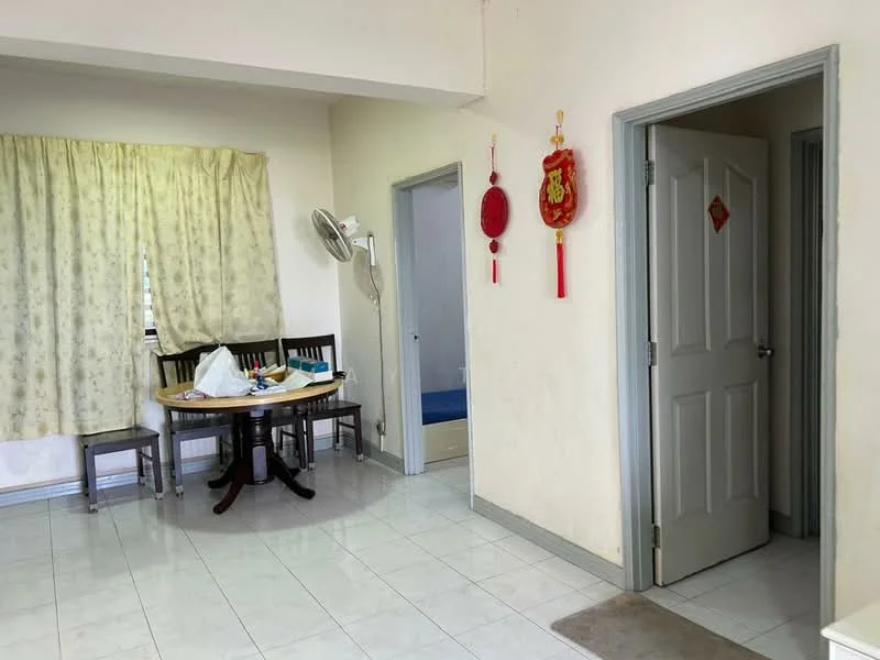 Room features: white painted walls, white tiled flooring, round dining table, 4 wooden dining chairs, floor-to-ceiling window with sheer curtains, wall-mounted ceiling fan, doorway leading to another room, decorative wall hangings, carpet mat at entrance.