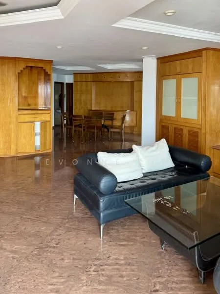 Living features: black leather sofa, glass coffee table, wooden cabinetry, marble flooring, crown moulding on ceiling, dining area in background, large windows, open layout; style: modern.