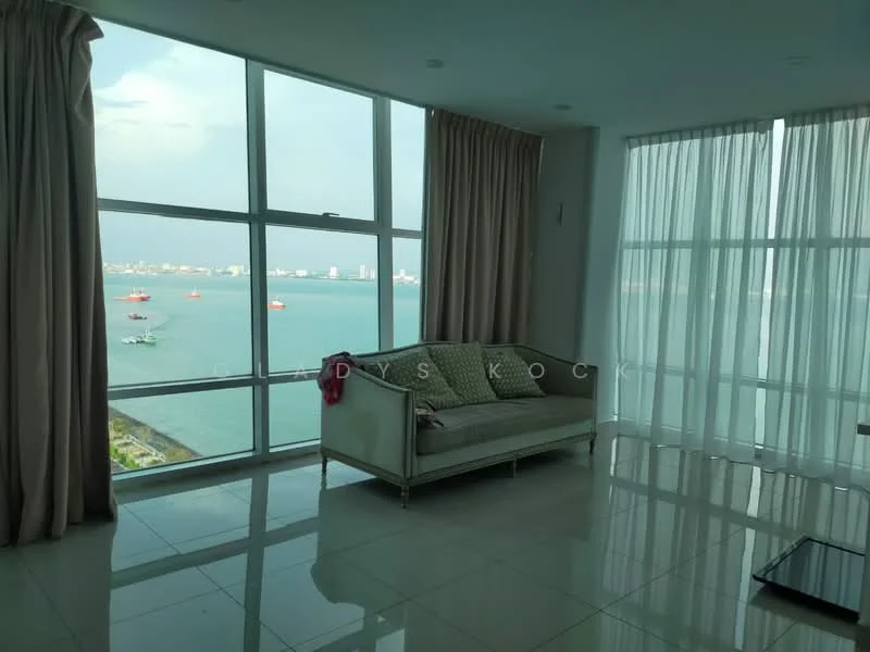 Living features: floor-to-ceiling windows, sea view, light grey fabric sofa, white walls, white tiled flooring, sheer curtains, recessed downlights, decorative wall, open layout; style: modern; view: sea.