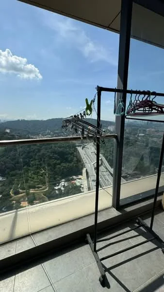 Room features: floor-to-ceiling windows, city view, grey tile flooring, clothes drying rack, hangers, natural light, balcony railing; view: city.