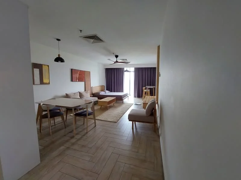 Living features: wooden flooring, white painted walls, ceiling fan with light, sofa in beige, coffee table, dining table with 4 chairs, area rug, floor-to-ceiling windows with purple curtains, wall-mounted artwork, recessed lighting; style: modern.
