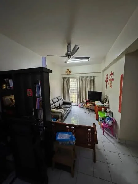 Living features: 3-seater fabric sofa in grey, ceiling fan, TV console, wall-mounted TV, curtains, white tiled flooring, decorative wall art, bookshelf, coffee table, various children's toys, natural light from window.