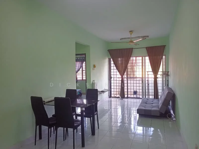 Living features: green painted walls, white tiled flooring, 5-blade ceiling fan, large windows with black grills, brown curtains, grey fabric sofa bed, glass dining table with black chairs, open layout; style: modern.