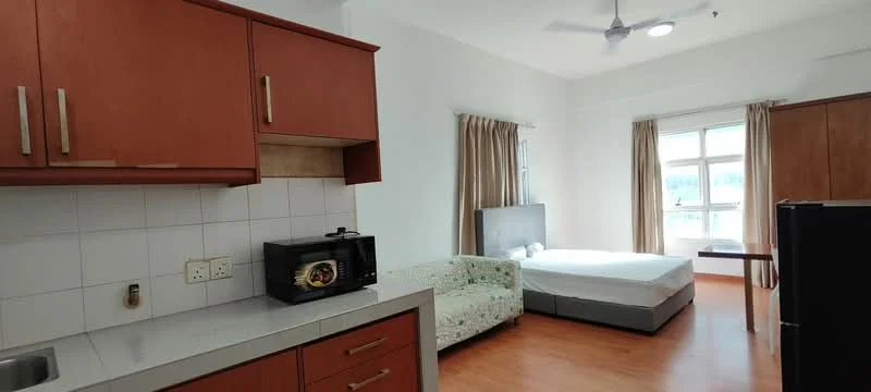Room features: brown wooden cabinetry, grey countertop, white tiled backsplash, microwave, refrigerator, sofa with floral pattern, queen-size bed, bedside table, floor-to-ceiling window, curtains, wooden flooring, ceiling fan; style: modern.