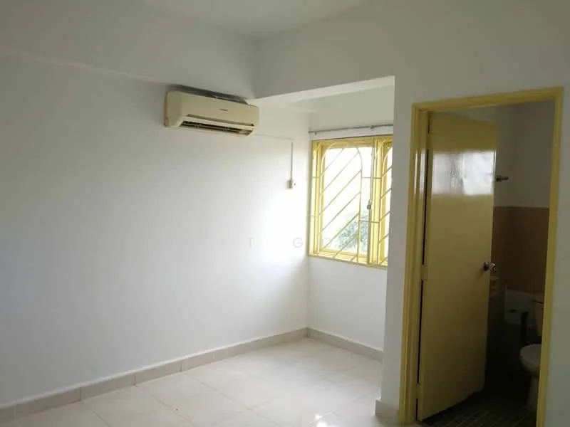 Room features: white painted walls, cream tiled flooring, 1 wall-mounted split AC, yellow window frames, grid-patterned window bars, door with yellow frame, light switch, visible bathroom door, neutral ceiling.