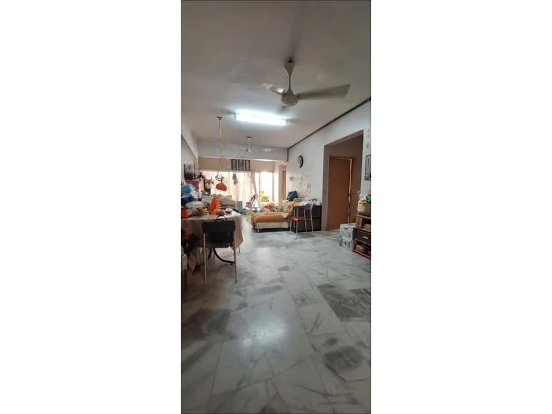 Living features: marble flooring, ceiling fan, large window with natural light, sofa, coffee table, decorative items on shelves, wall clock, dining table, various storage boxes, light-colored walls.
