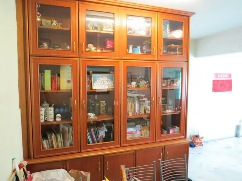 Room features: wooden cabinetry with glass doors, multiple shelves, decorative items displayed, books visible, storage space, light-colored walls, marble flooring; style: traditional.