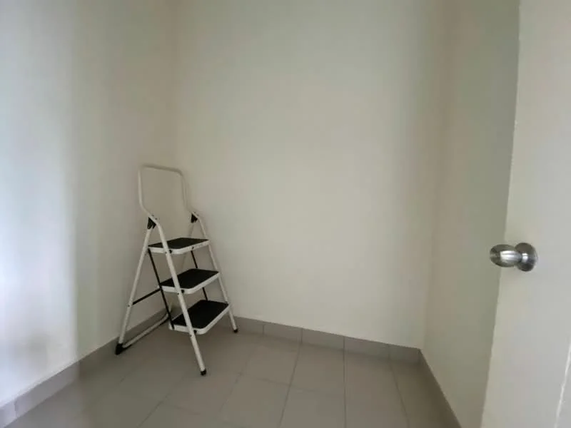 Room features: white painted walls, grey floor tiles, step ladder, door with round knob.