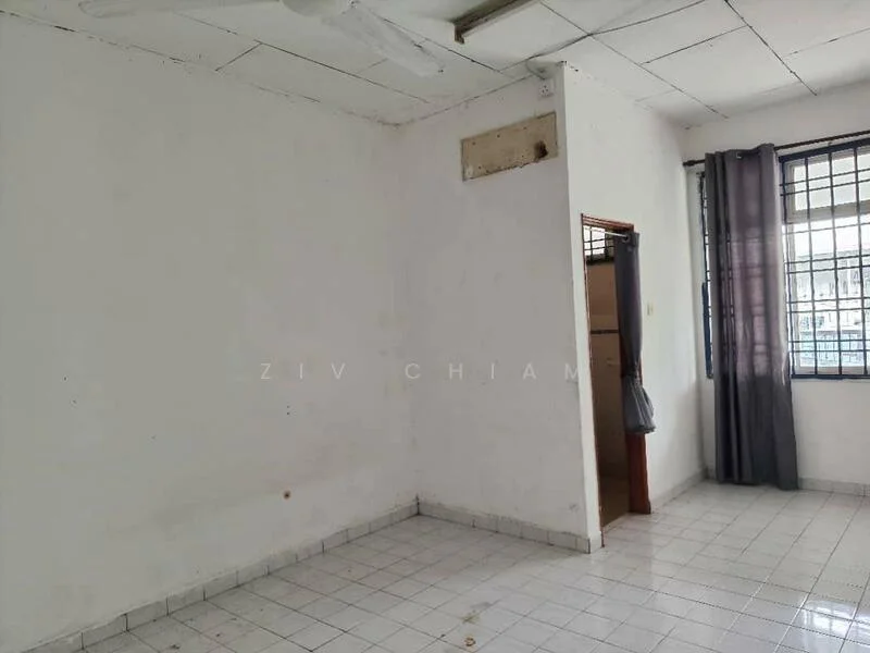 Room features: white painted walls, tile flooring, ceiling fan, window with metal grille, curtains, corner wall with exposed area, light fixture, empty space.