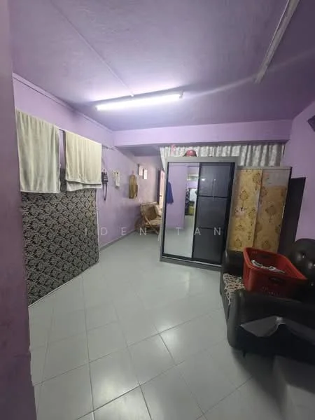 Room features: purple painted walls, white ceiling, tile flooring, two large windows with sheer curtains, black sliding wardrobe, brown fabric sofa, folding chair, plastic laundry basket, decorative room divider, wall-mounted air conditioning unit, LED ceiling lights.