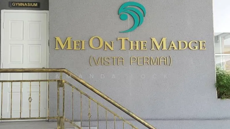 Exterior features: signage with gold lettering, grey painted facade, staircase with gold railing, entrance door, gymnasium sign; style: modern.